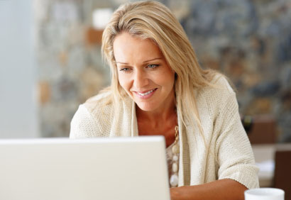 Photo of woman using a laptop